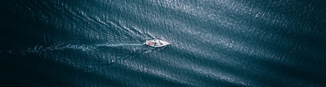 Sailboat on open water representing purpose and connection